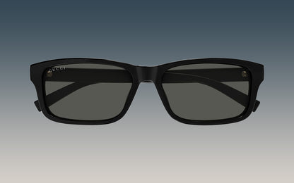 Gucci GG1986SA 001 Black Rectangular Sunglasses with a thick black frame and dark gray lenses, shown against a gradient gray background.