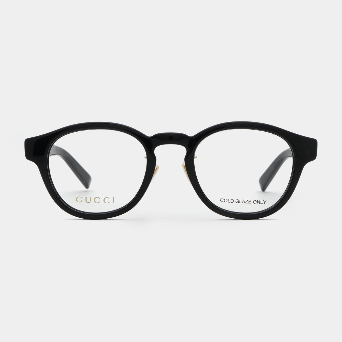 Gucci GG1988OK-001 Black Square Round Eyeglasses with gold-tone metal hinges and gold lettering on the inside of the lenses, shown against a light gray background.