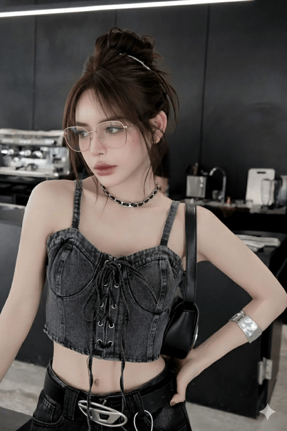 Woman wearing a black denim crop top and black pants with Gucci GG2006OA 003 Gold Eyeglasses in a kitchen setting