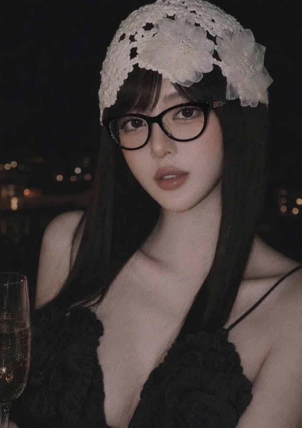 Girl wearing Gucci GG2034O 001 Black Cat-Eye Eyeglasses in black satin dress with floral wool hair accessories