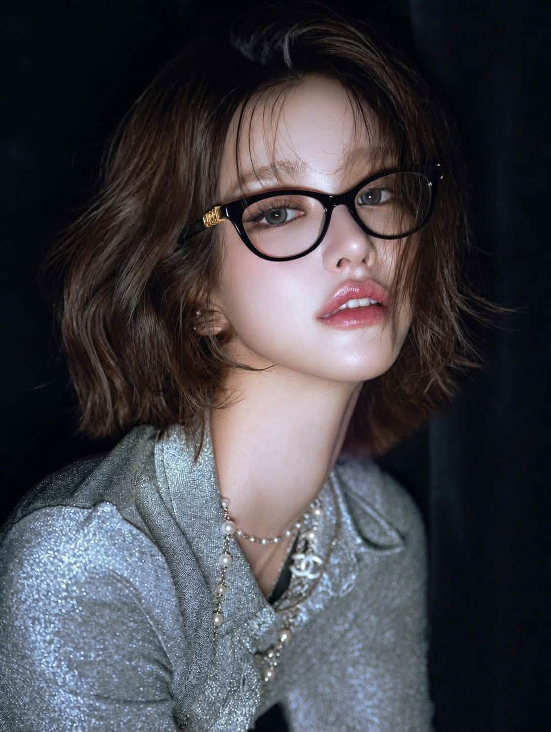 Woman wearing Gucci GG2034O 001 Black Cat-Eye Eyeglasses in silver jacket and chanel necklace