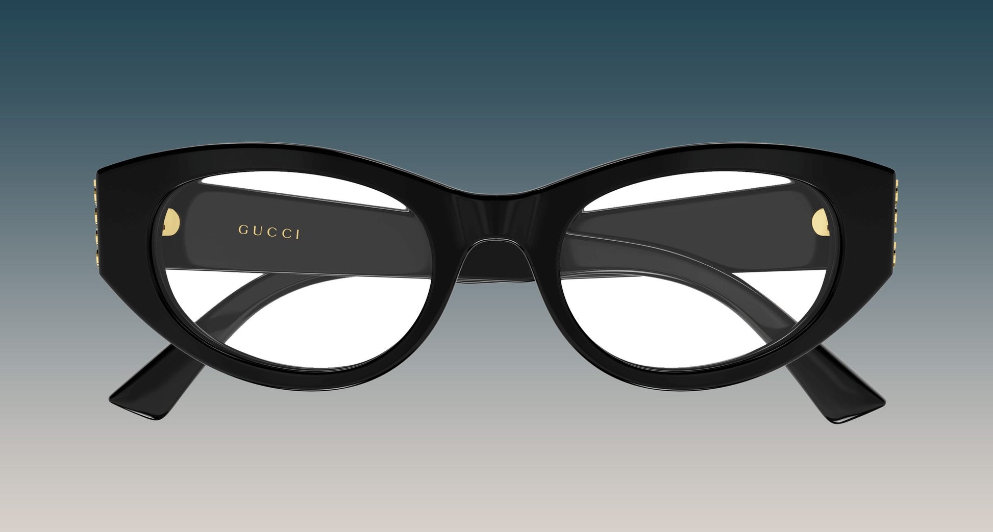 Gucci GG2041O-001 Black Oval Eyeglasses with gold-tone rivets and the Gucci logo printed on the inner temple, shown against a blue-to-gray gradient background.
