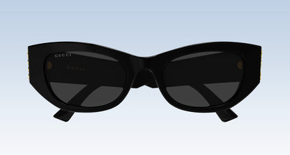Gucci GG2044SA-001 Black Soft Rectangular Sunglasses with a glossy black frame and dark lenses, shown against a light blue gradient background.