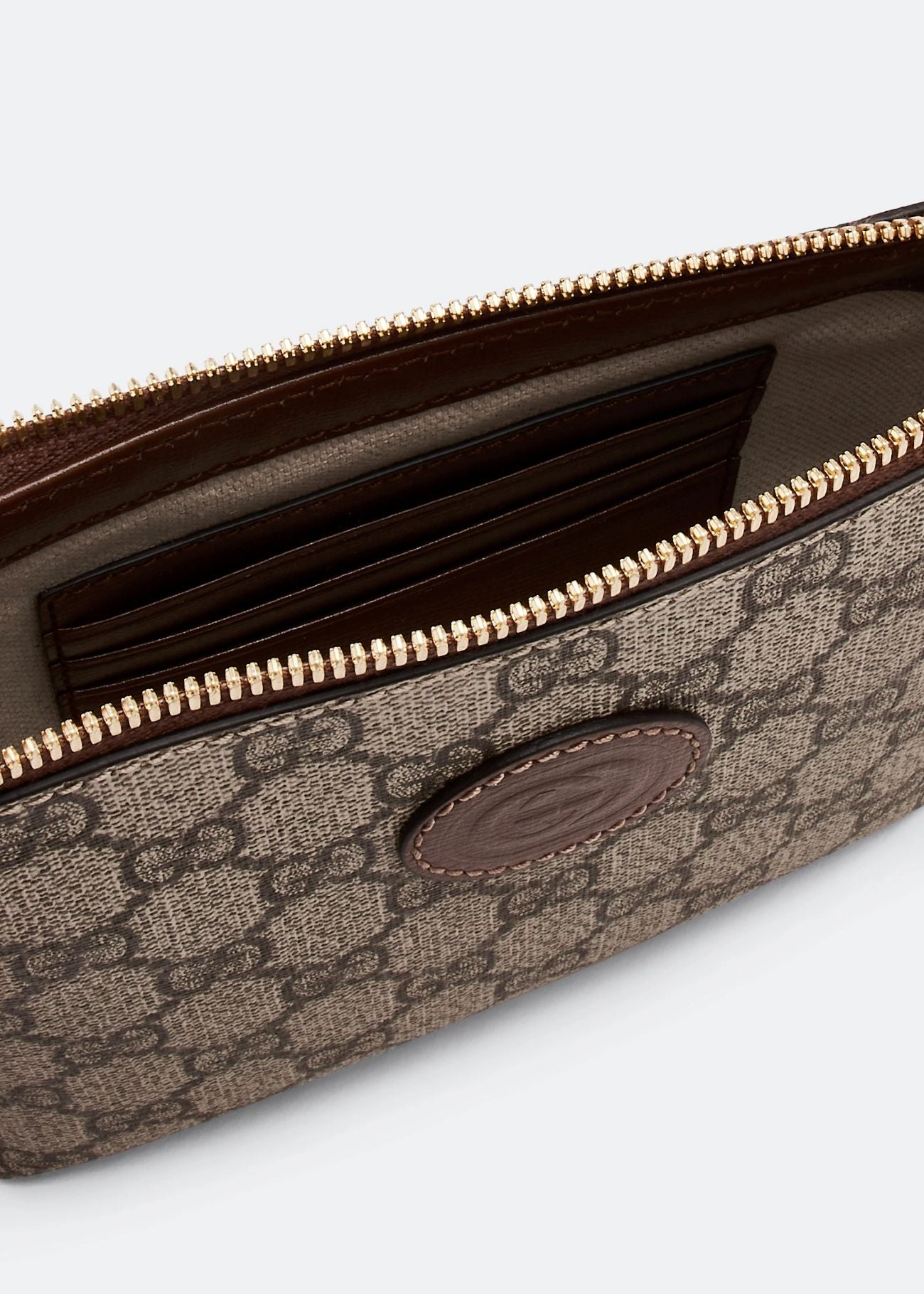 Open Gucci Interlocking G Mini Messenger Bag Beige 723306 92THG 8563 with gold zipper on a light gray background