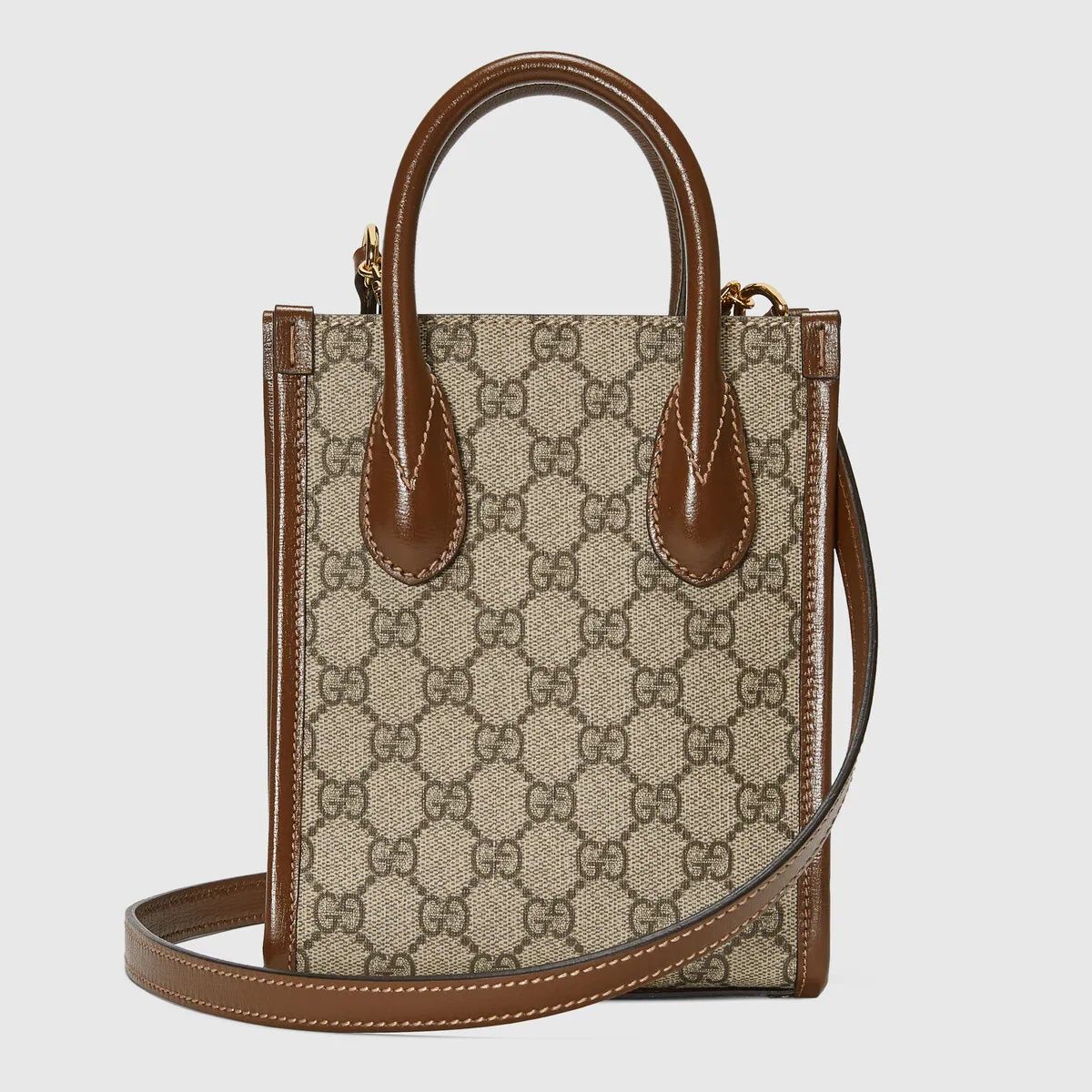 Gucci Interlocking G Mini Tote Bag 671623 92TCG 8563 with brown leather accents on a light gray background