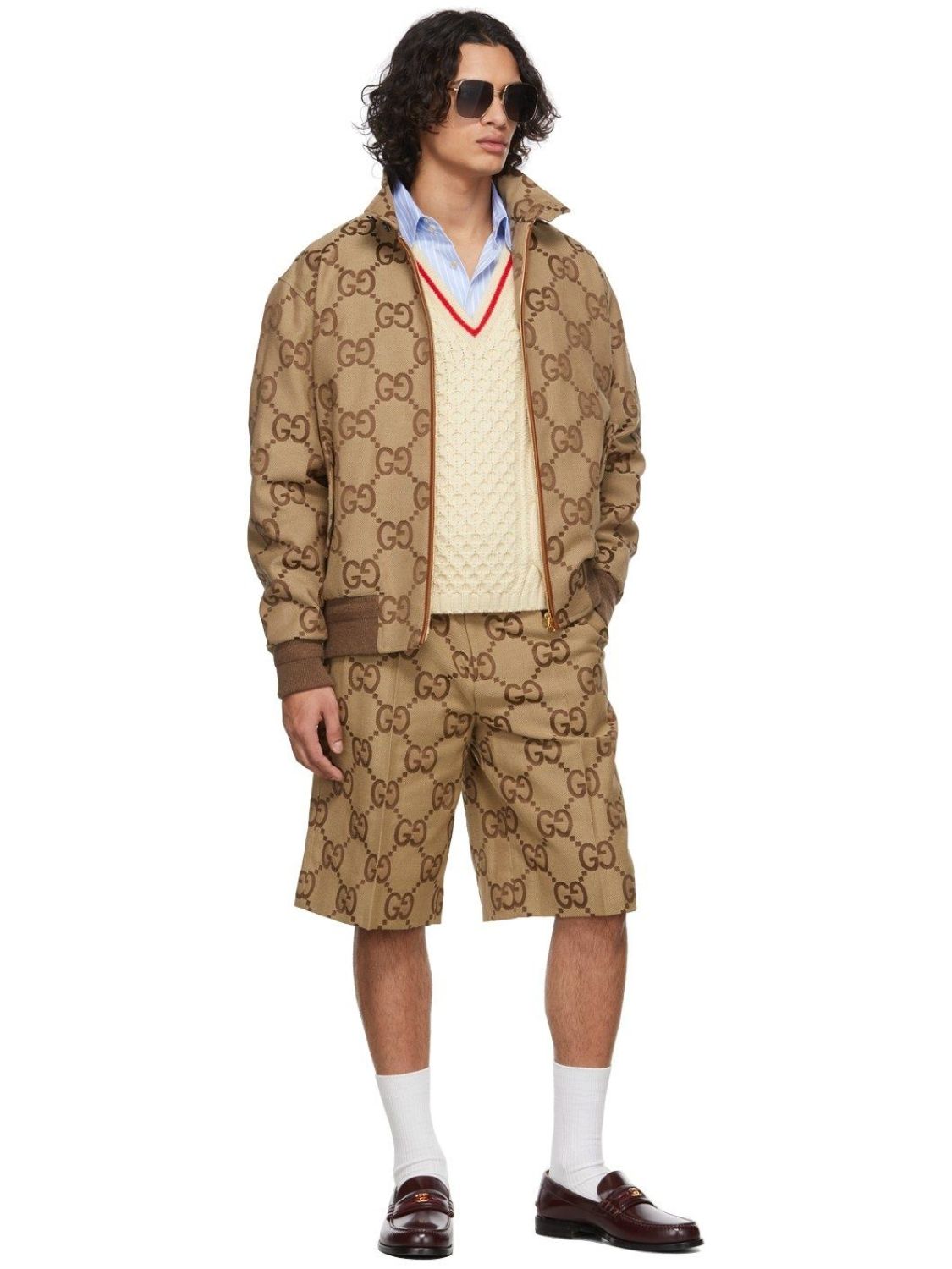 Man wearing a Gucci Jumbo GG Canvas Short In Beige & Ebony 673181 ZAHT6 2580 on a white background