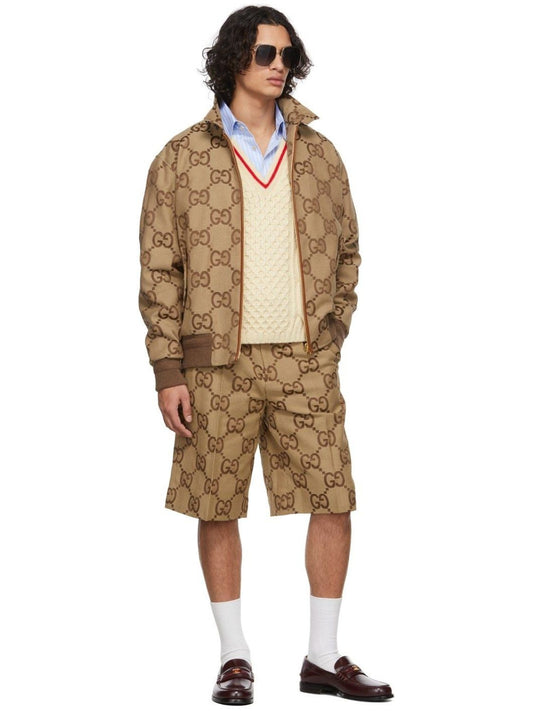 Man wearing a Gucci Jumbo GG Canvas Short In Beige & Ebony 673181 ZAHT6 2580 on a white background