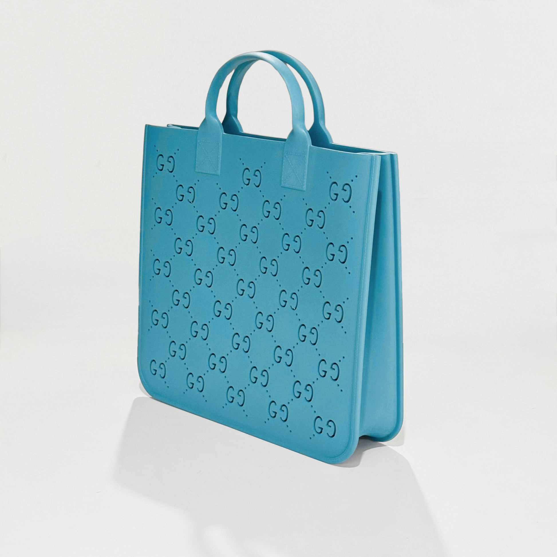 Gucci Kids GG Rubber Shopper Bag Light Blue 679365 JFO00 4933 with brand logo pattern on a white background