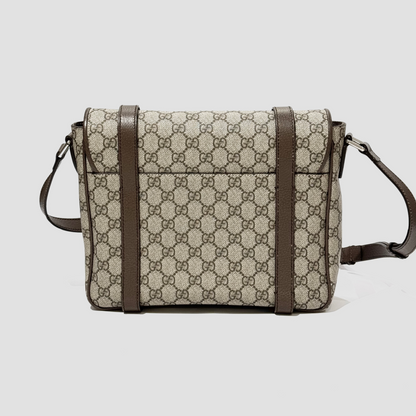 Gucci Medium Messenger Interlocking GG Bag Supreme Beige Ebony 658542 K9GSN 8538 with patterned fabric and brown leather straps on a light gray background