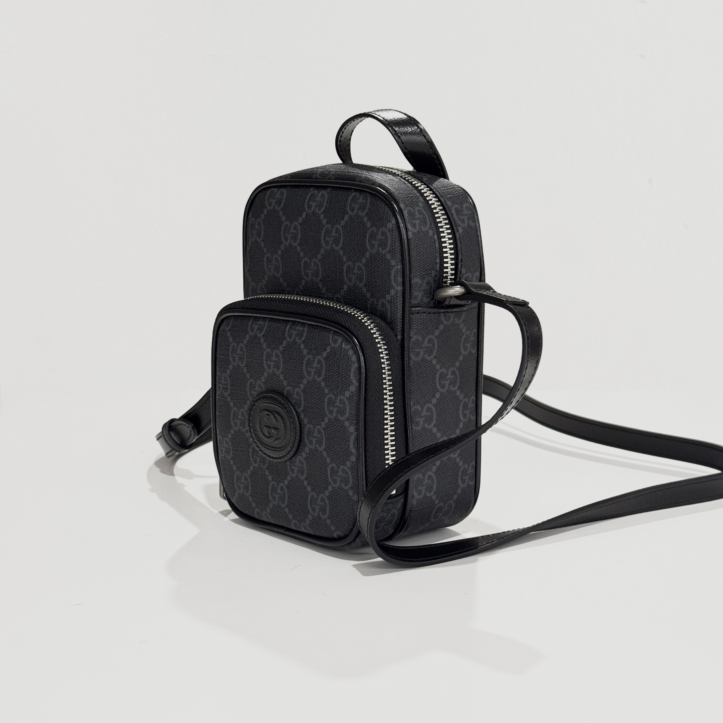 Gucci Mini Crossbody Bag with Interlocking G Black 672952 92TCN 1000 on a light gray background