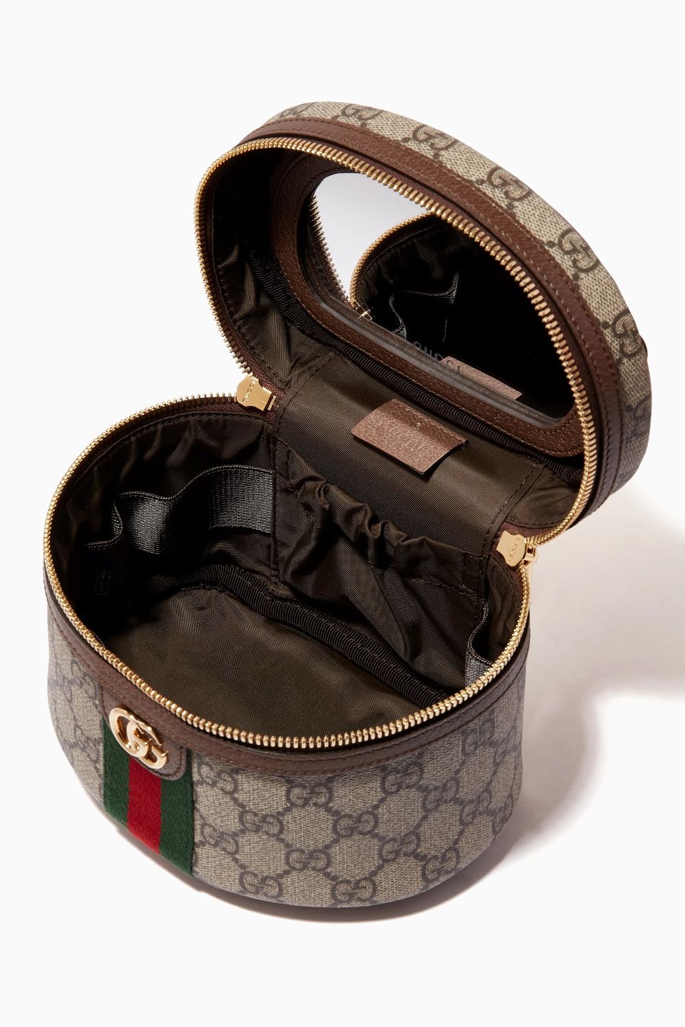 Round Gucci jewelry case with open lid on a white background