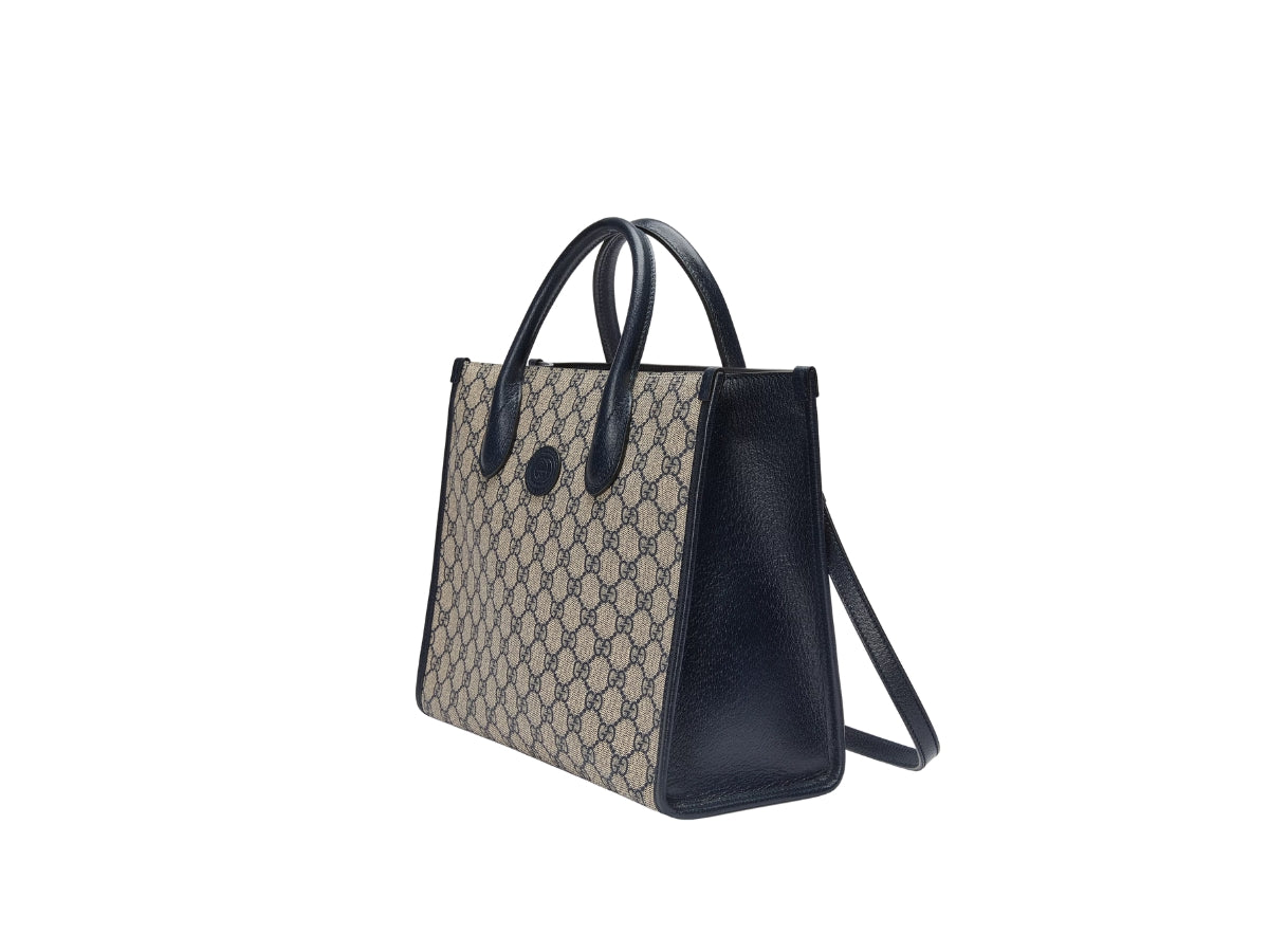 Gucci Small Tote Bag With Interlocking G Navy 659983 K9GSN 4075 with patterned top section and solid black bottom section on a white background