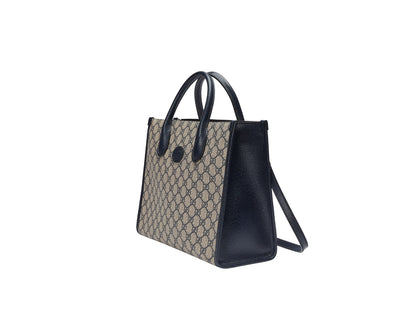 Gucci Small Tote Bag With Interlocking G Navy 659983 K9GSN 4075 with patterned top section and solid black bottom section on a white background