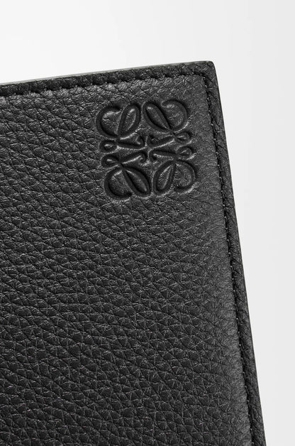 Close-up of a bLoewe Bifold Coin Wallet in Soft Grained Calfskin – Black C660501X03-1100 with a anagram logo on a white background