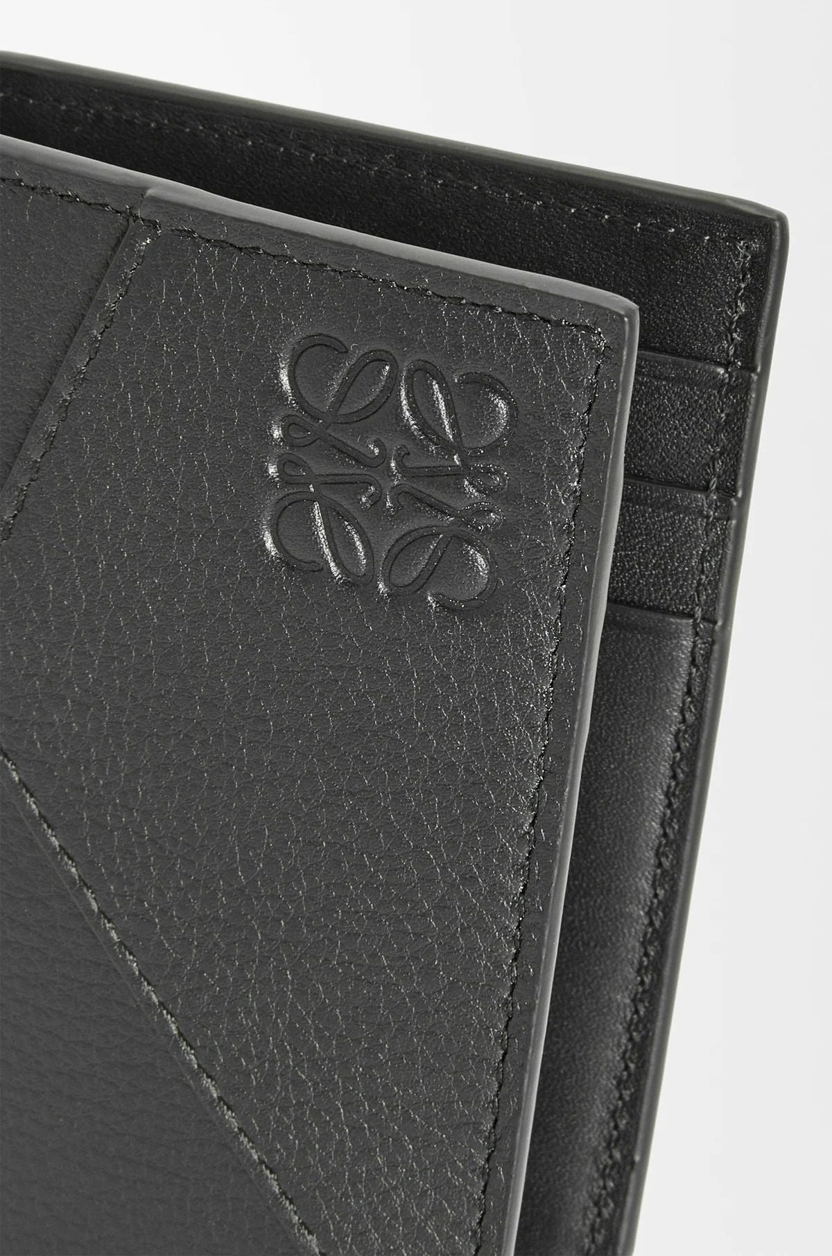 Loewe Puzzle Bifold Cardholder in Classic Calfskin – Black C510144X10_1100 with anagram logo on a light gray background