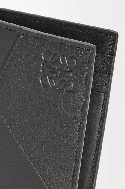 Loewe Puzzle Bifold Cardholder in Classic Calfskin – Black C510144X10_1100 with anagram logo on a light gray background