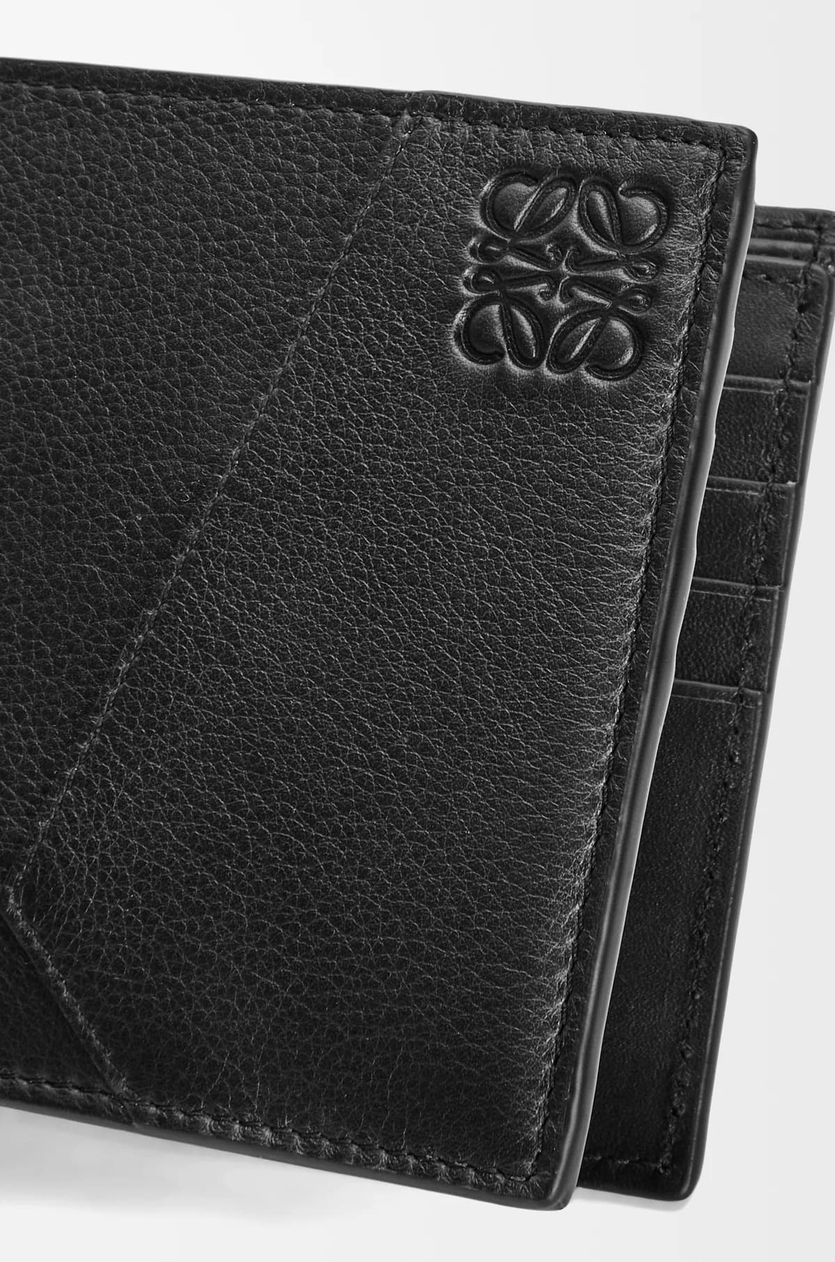 Loewe Puzzle Bifold Wallet in Black Classic Calfskin C510302X16-1100 with brand logo on a white background