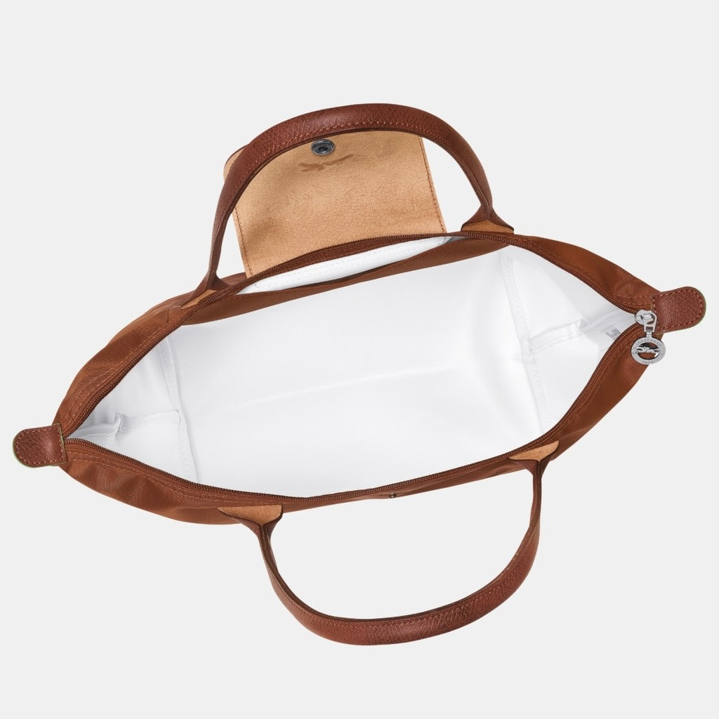 Longchamp Le Pliage Green M Tote Bag – Cognac L2605919504 with white interior on a light gray background