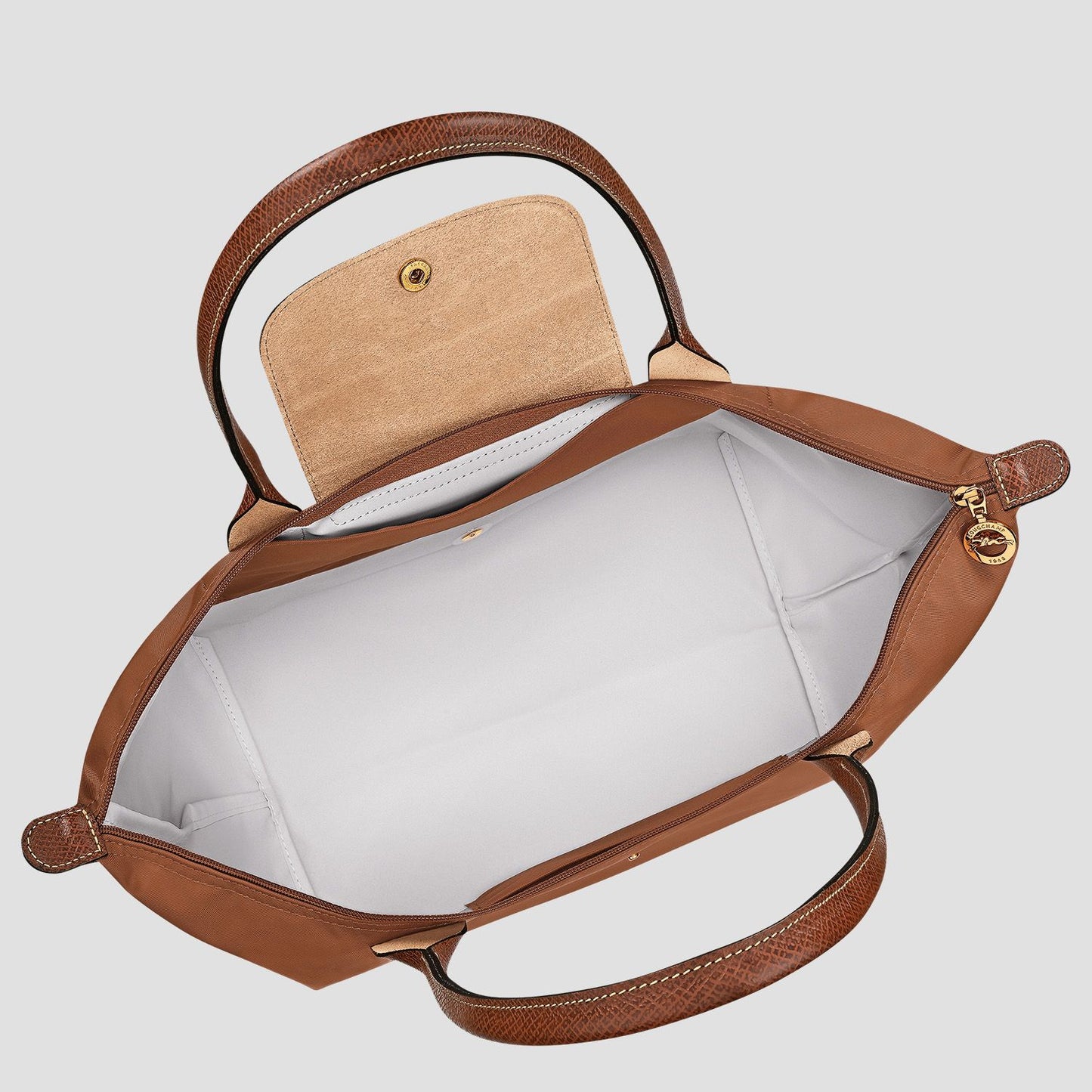 Longchamp Le Pliage Original L Tote Bag – Cognac L1899089504 with gold hardware on a light gray background