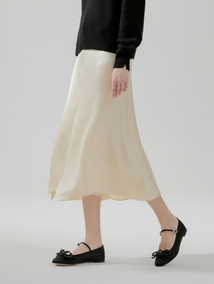 Person wearing a beige skirt and MACH & MACH Double Bow Black Satin Ballerinas on a plain background