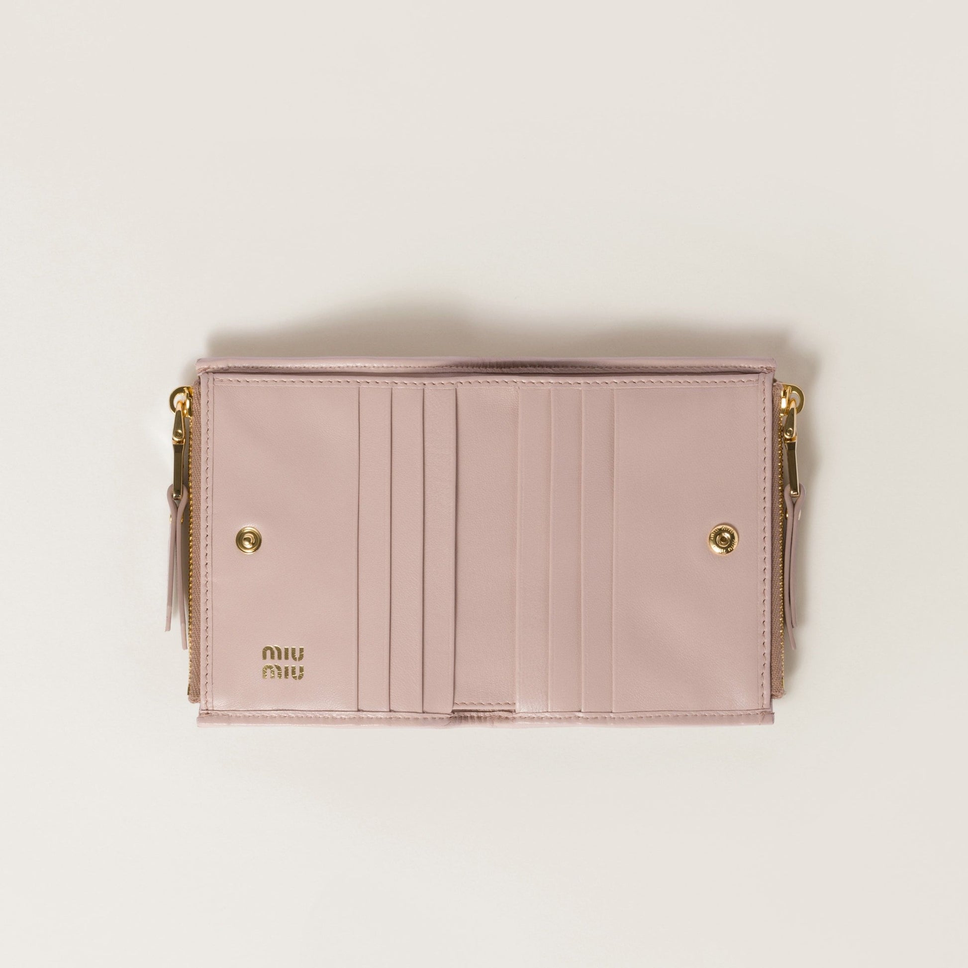 Open Miu Miu Matelassé Nappa Leather Small Wallet Powder Pink 5ML024_AFPP_F0236 with gold accents on a light beige background