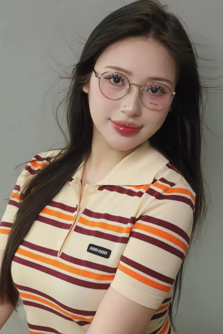 wearing MIU MIU MU 52XV 5AK101 ROUND EYEGLASSES