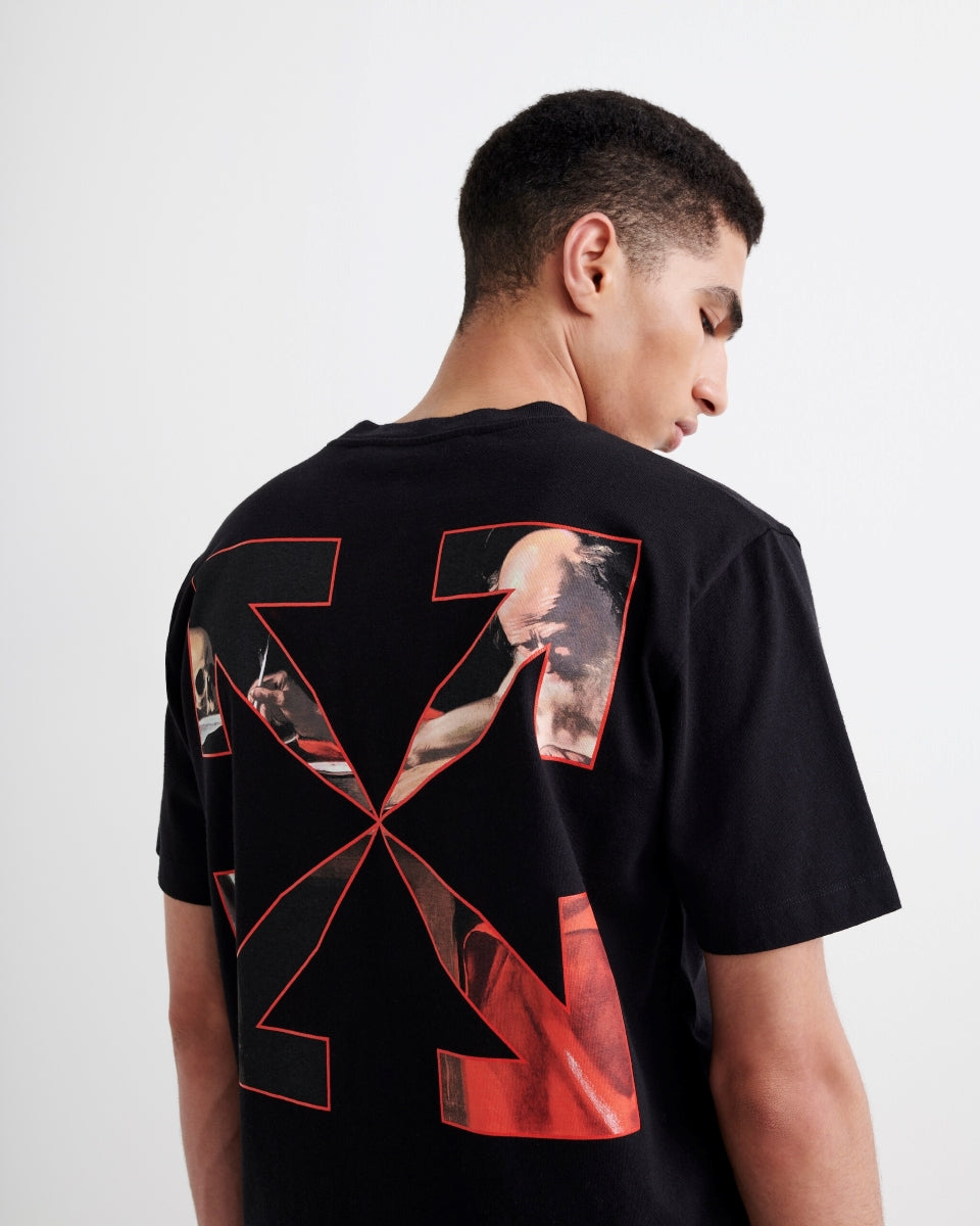 wearing OFF-WHITE BLACK CARAVAGGIO ARROW S/S T-SHIRT OMAA038R21JER0031025