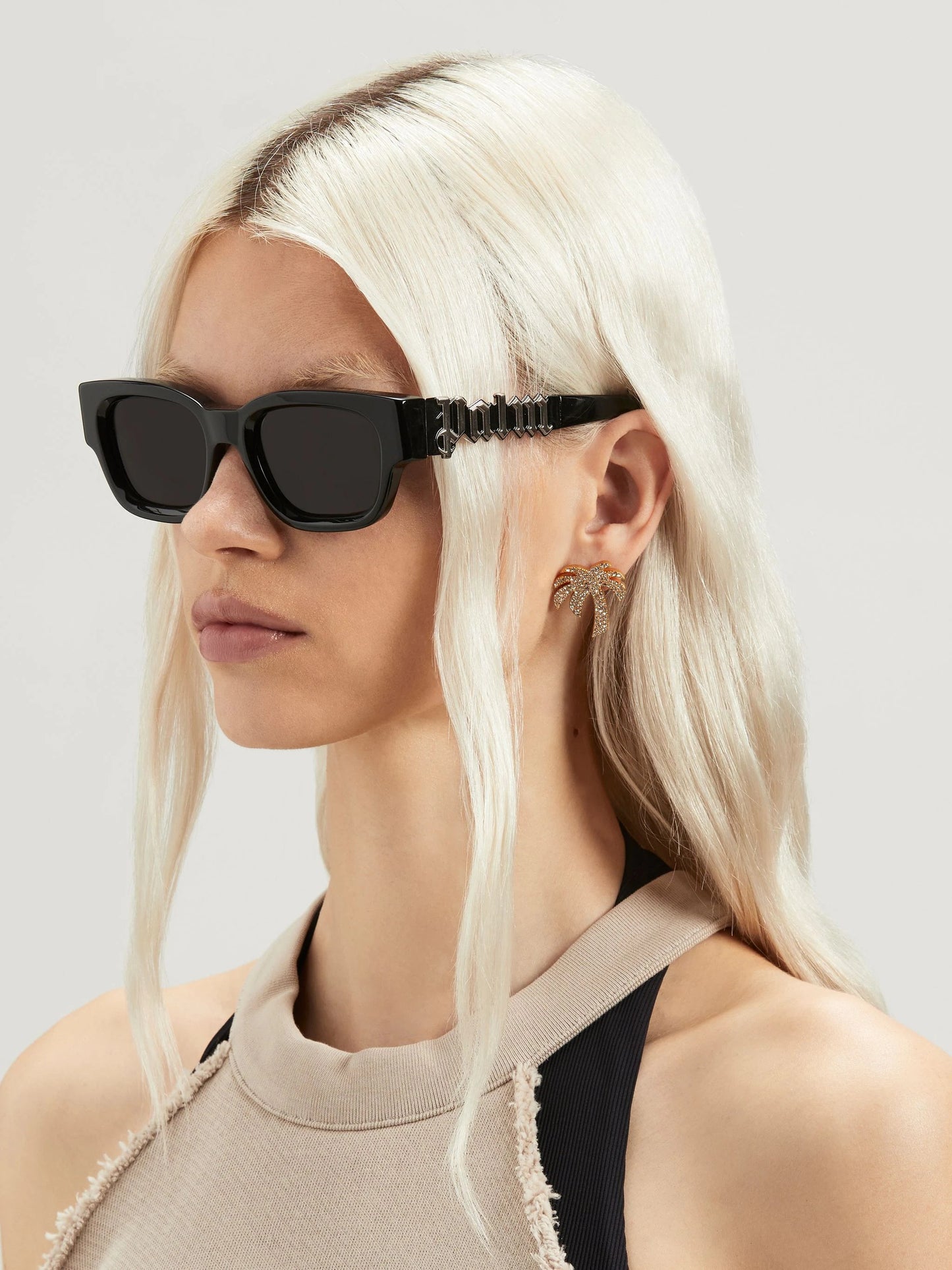 wearing PALM ANGELS POSEY SUNGLASSES BLACK