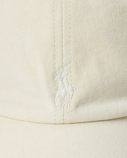 Close-up of a beige fabric with a brand logo on a white background