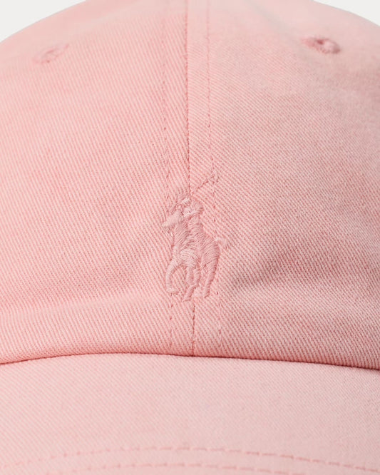 Close-up of a pink cap with a logo on a white background