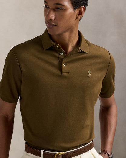 Man wearing a Polo Ralph Lauren Men’s Soft Cotton Polo Shirt Classic Fit – Nature Brown 710660606205 with a logo on a neutral background