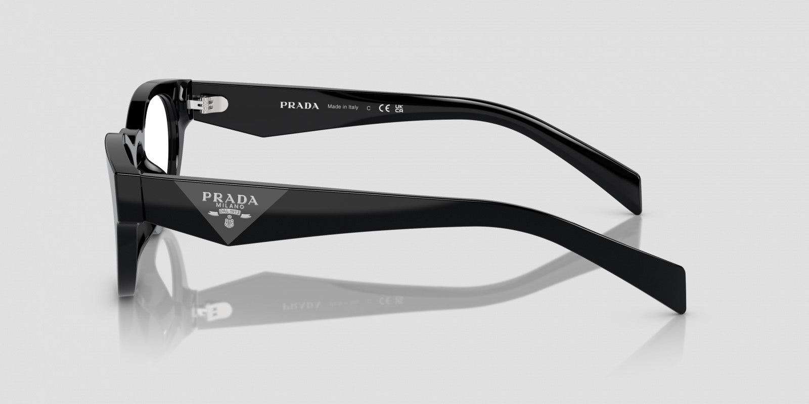 beside Prada PR A11VD 16K1O1 Oval Black Eyeglasses on a white background