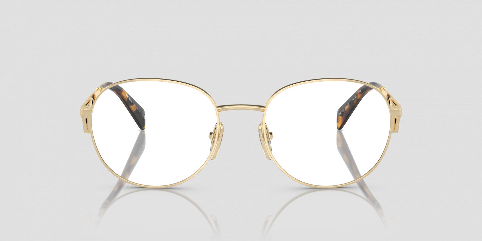 Prada PR A50V ZVN1O1 Round Gold Eyeglasses with tortoiseshell accents on a light gray background
