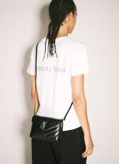 Person wearing a white t-shirt with 'Saint Laurent' branding and carrying a Saint Laurent Loulou Toy Quilted Leather in Black 678401DV7061000