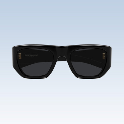 Saint Laurent SL 740 005 with a glossy black acetate frame and dark lenses, shown against a light blue gradient background.