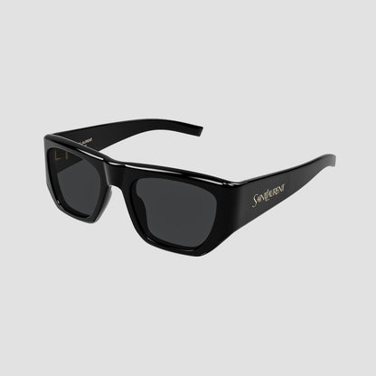 Saint Laurent SL 740 005 with dark lenses and gold 'Saint Laurent' branding on the temple, shown on a light gray background.