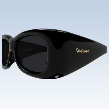Saint Laurent SL 901 HOWL-001 oversized black sunglasses with dark lenses and gold logo lettering on the temple, shown against a light blue gradient background.