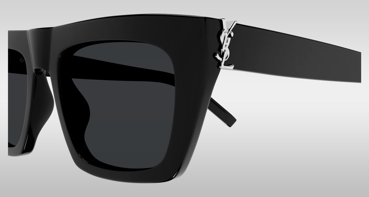 Saint Laurent SL M131 001 Black Square Sunglasses with dark lenses and a silver-tone YSL logo on the temple arm, shown against a light gray gradient background.