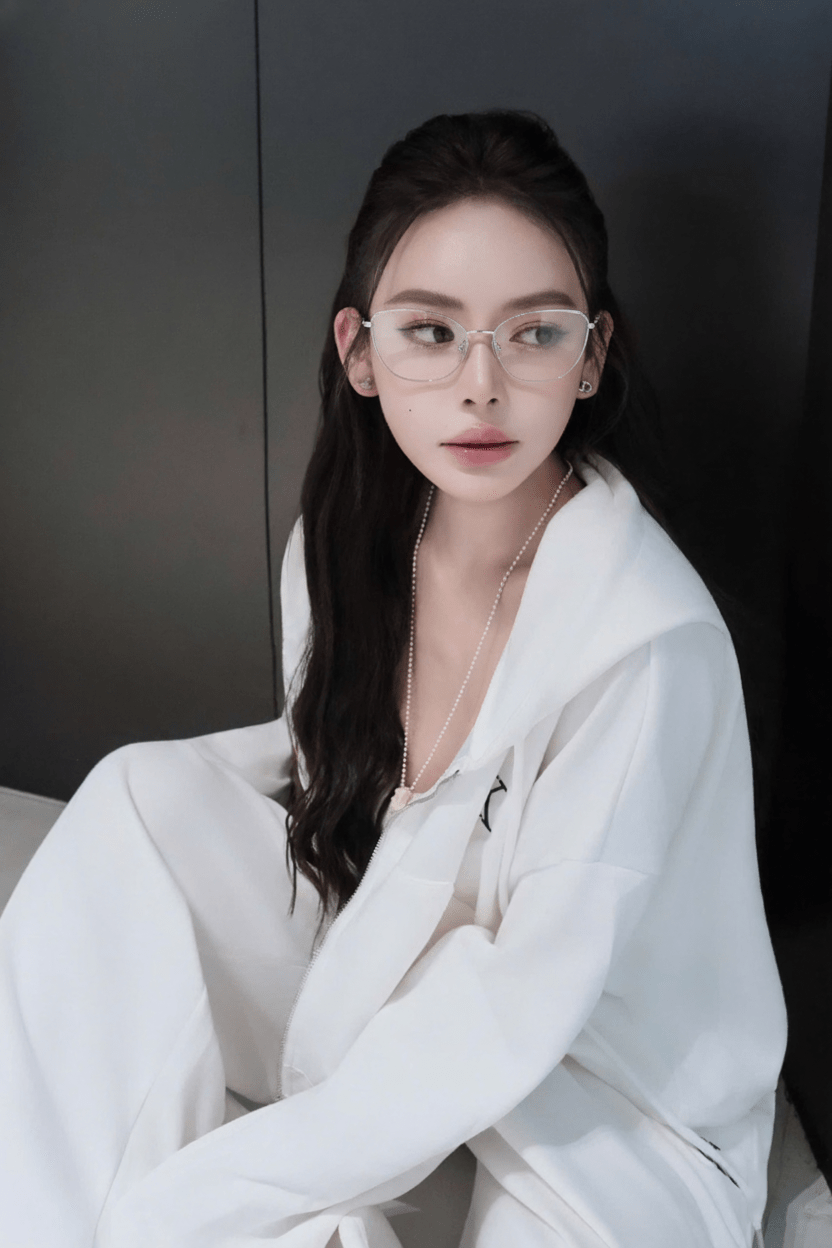 Woman wearing Tiffany TF1166 6001 Silver Eyeglasses and a white robe against a dark background