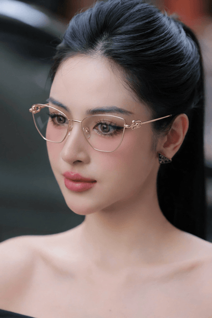 Woman wearing Tiffany TF1166 6021 Gold Eyeglasses with a blurred background