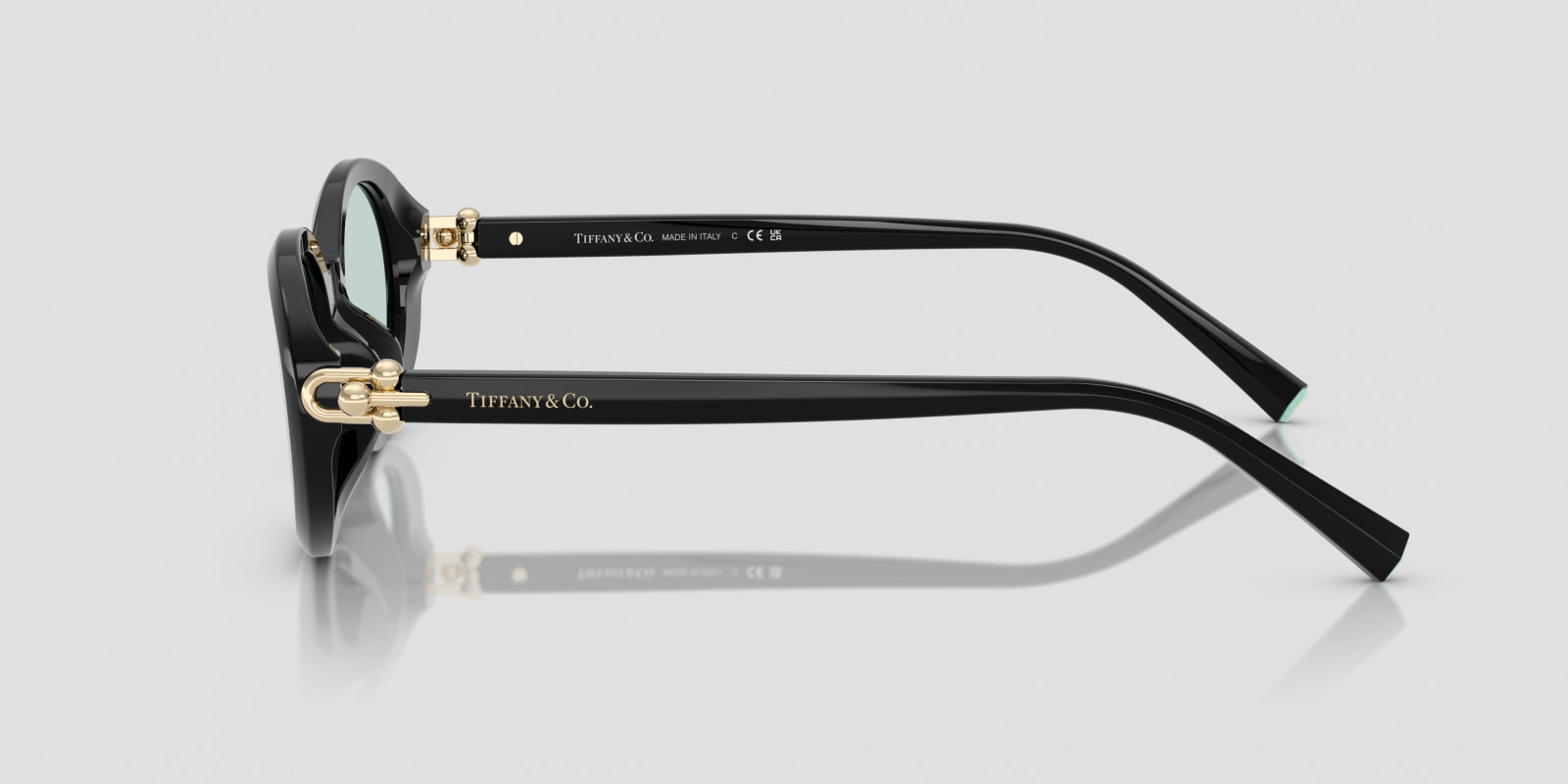 Tiffany & Co. glasses on a light gray background