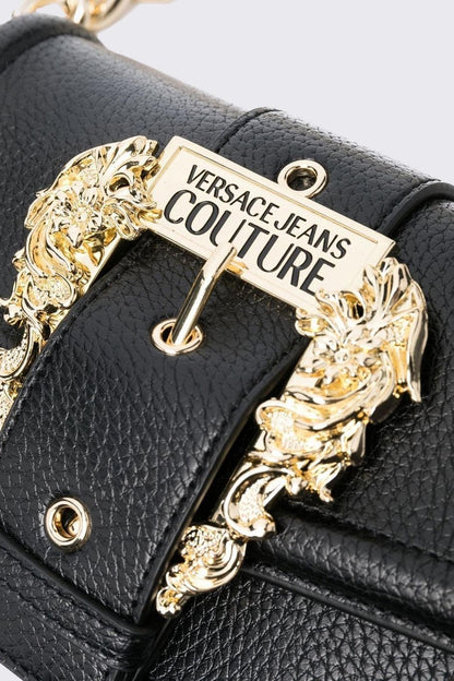 Black Versace handbag with gold decorative clasp on a light gray background