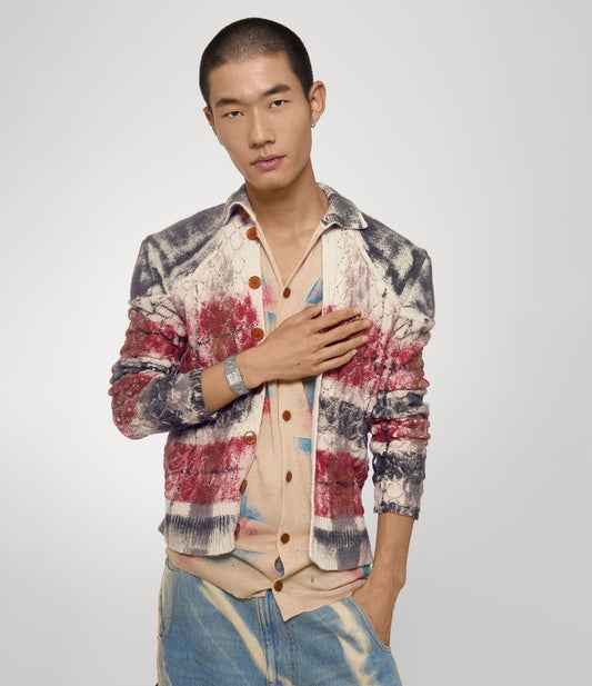 Man wearing a colorful jacket over a patterned shirt with Vivienne Westwood Brunswick Grey Dial Silver Watch VV333LGYSL 8050164231897 on a plain background