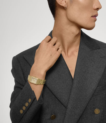 Person wearing a Vivienne Westwood Brunswick Olive Dial Gold Watch VV333LOLGD 8050164231903 on a gray background