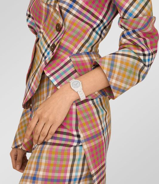 Person wearing a colorful plaid suit with a Vivienne Westwood Fenchurch Ceramica Blue White Watch vv358lblwh 8050164232115 on a plain background