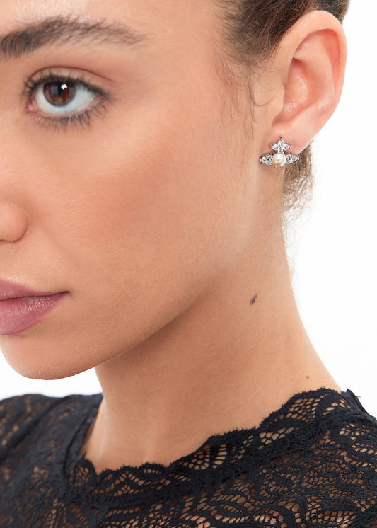 Close-up of a woman wearing a Vivienne Westwood Feodora Earrings Creamrose Pearl 6201034Y-02P373 8050889777670 on a white background