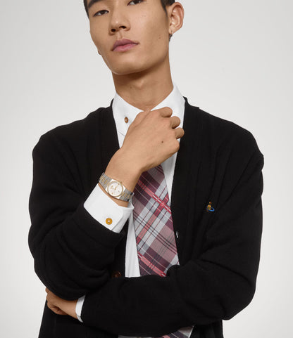 Man wearing a black blazer, white shirt, and Vivienne Westwood Hoxton Dual-Tone Silver Watch VV332SLSG 8050164231880 on a plain background