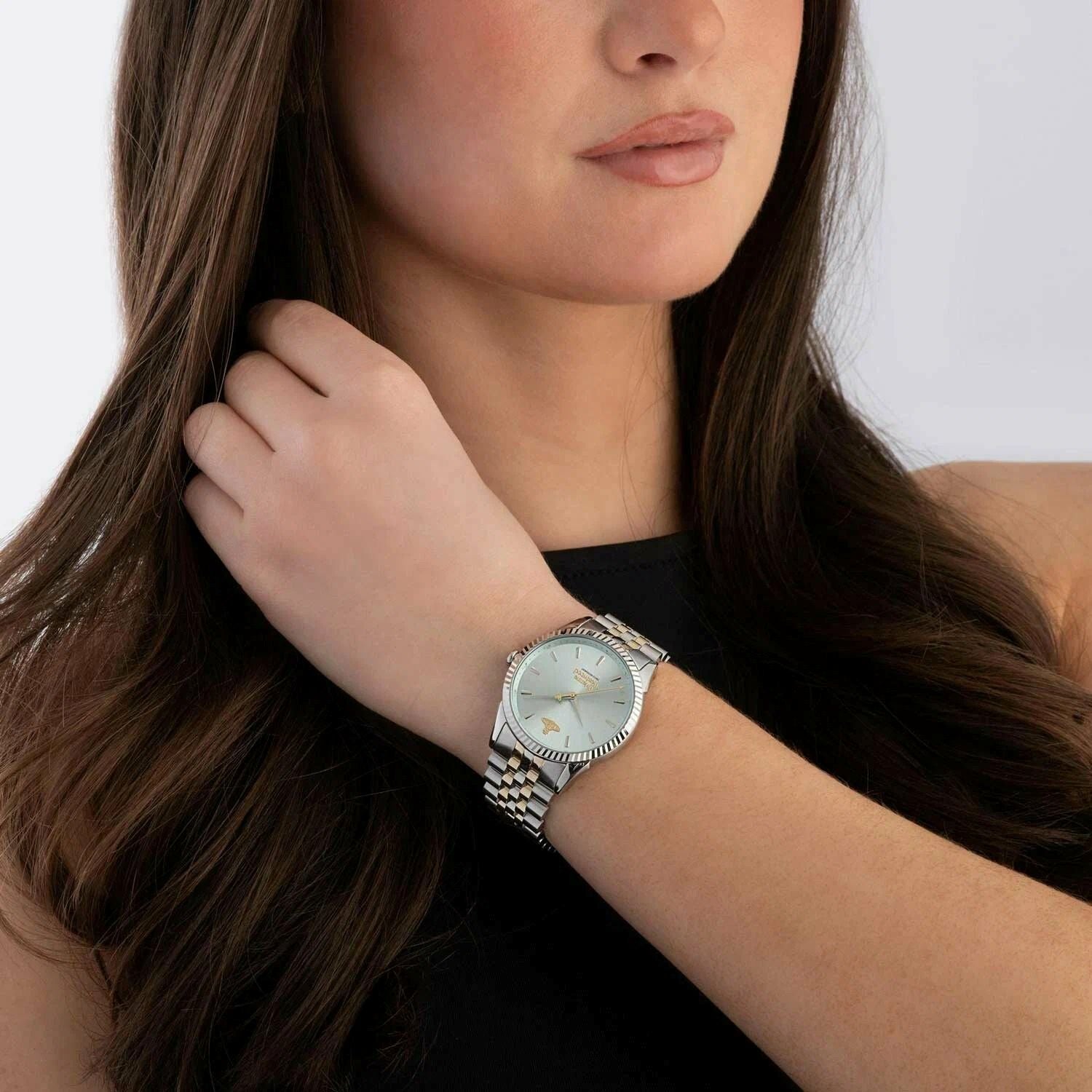 Woman wearing a Vivienne Westwood Seymour Blue Dial Silver Watch vv240lgrsg on her wrist with a neutral background